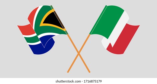 Crossed and waving flags of South Africa and Italy