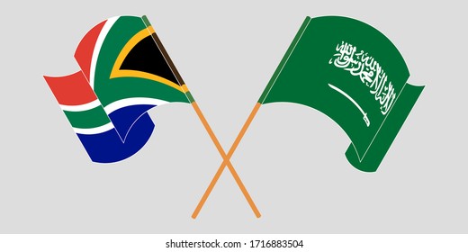 Crossed and waving flags of South Africa and the Kingdom of Saudi Arabia