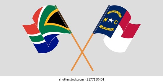 Crossed and waving flags of South Africa and The State of North Carolina. Vector illustration
