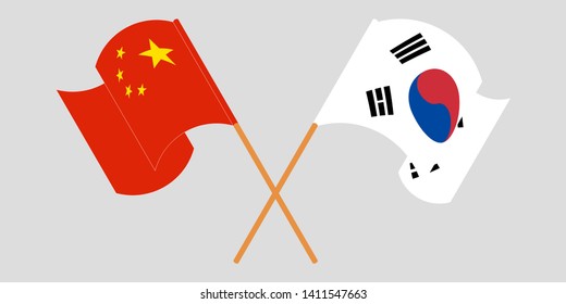 Crossed and waving flags of South Korea and China
