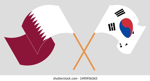 Crossed and waving flags of South Korea and Qatar