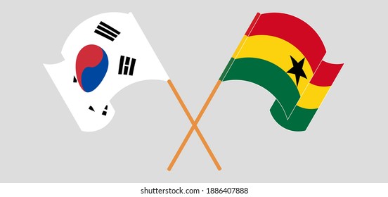 Crossed and waving flags of South Korea and Ghana