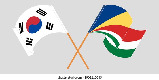 Crossed and waving flags of South Korea and Seychelles
