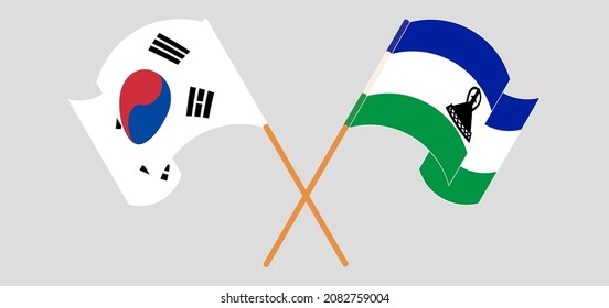 Crossed and waving flags of South Korea and Kingdom of Lesotho. Vector illustration
