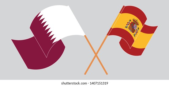 Crossed and waving flags of Spain and Qatar
