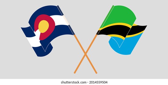 Crossed and waving flags of The State of Colorado and Tanzania