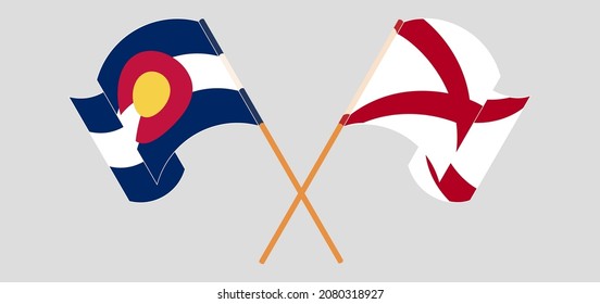 Crossed and waving flags of The State of Colorado and The State of Alabama. Vector illustration
