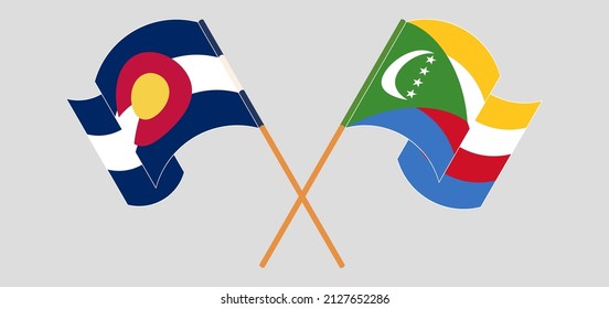 Banderas cruzadas y ondeando banderas del Estado de Colorado y Comoras. Ilustración del vector
