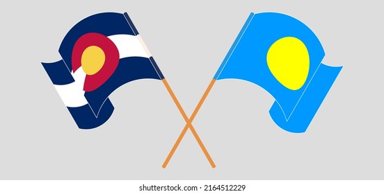 Crossed and waving flags of The State of Colorado and Palau. Vector illustration
