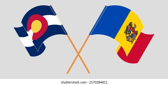 Crossed and waving flags of The State of Colorado and Moldova. Vector illustration
