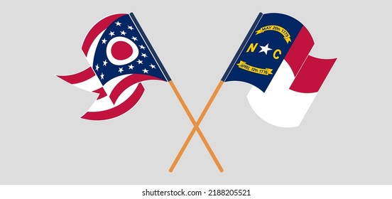 Crossed and waving flags of the State of Ohio and The State of North Carolina. Vector illustration
