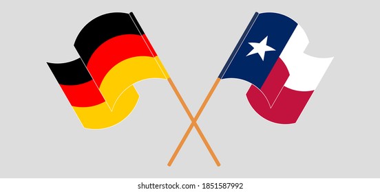 Banderas cruzadas y ondeando banderas del Estado de Texas y Alemania