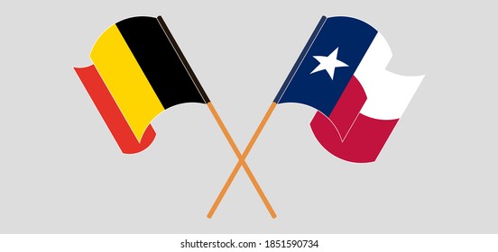 Crossed and waving flags of the State of Texas and Belgium