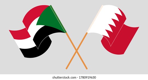 Crossed and waving flags of Sudan and Bahrain
