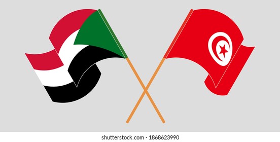 Crossed and waving flags of Sudan and Tunisia