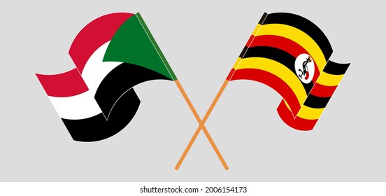 Überquerte und wehende Flaggen des Sudan und Ugandas