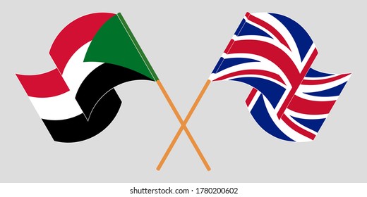 Crossed and waving flags of Sudan and the UK