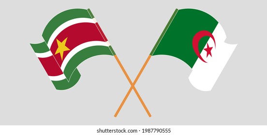 Crossed and waving flags of Suriname and Algeria