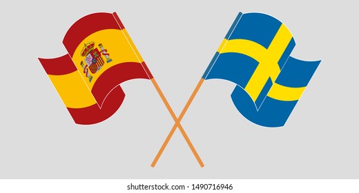 Crossed and waving flags of Sweden and Spain