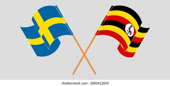 Crossed and waving flags of Sweden and Uganda