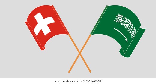 Crossed and waving flags of Switzerland and the Kingdom of Saudi Arabia