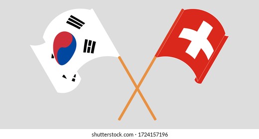 Crossed and waving flags of Switzerland and South Korea