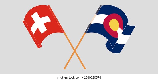 Crossed and waving flags of Switzerland and The State of Colorado