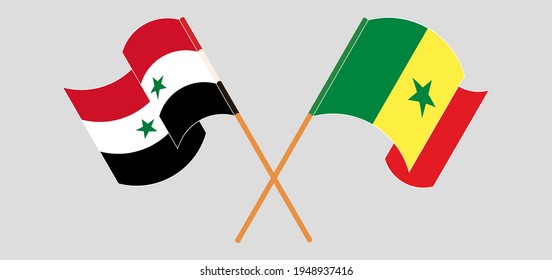 Crossed and waving flags of Syria and Senegal