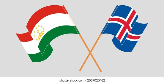 Crossed and waving flags of Tajikistan and Iceland