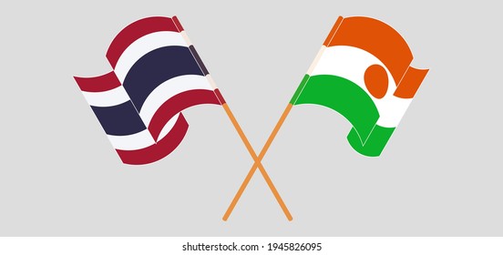 Crossed and waving flags of Thailand and Niger