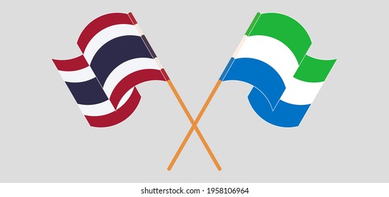 Crossed and waving flags of Thailand and Sierra Leone