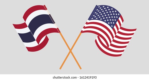 Crossed and waving flags of Thailand and the USA