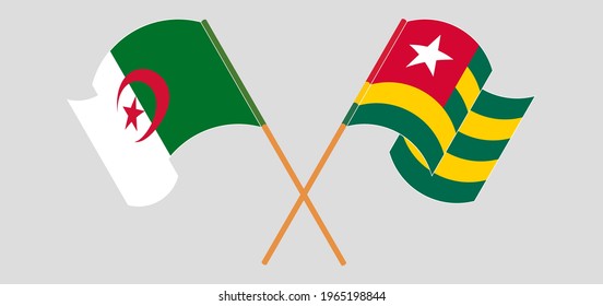 Crossed and waving flags of Togo and Algeria