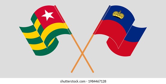 Crossed and waving flags of Togo and Liechtenstein