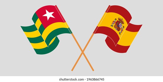 Banderas cruzadas y ondeando banderas de Togo y España