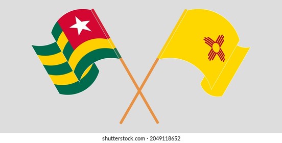 Crossed and waving flags of Togo and the State of New Mexico