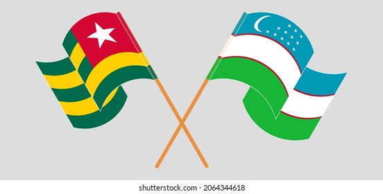 Crossed and waving flags of Togo and Uzbekistan