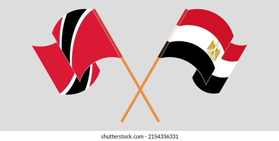 Crossed and waving flags of Trinidad and Tobago and Egypt. Vector illustration
