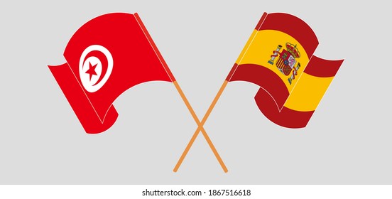 Crossed and waving flags of Tunisia and Spain