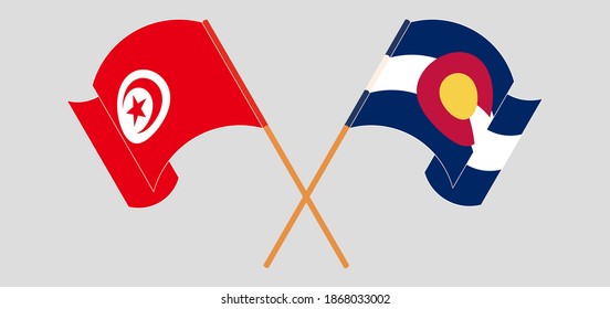 Crossed and waving flags of Tunisia and The State of Colorado