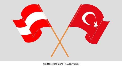 Crossed and waving flags of Turkey and Austria