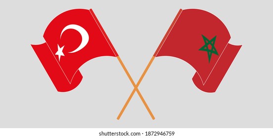 Crossed and waving flags of Turkey and Morocco