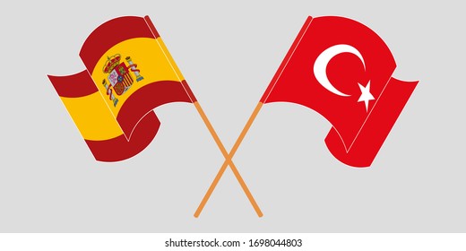 Crossed and waving flags of Turkey and Spain