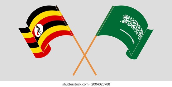 Crossed and waving flags of Uganda and the Kingdom of Saudi Arabia
