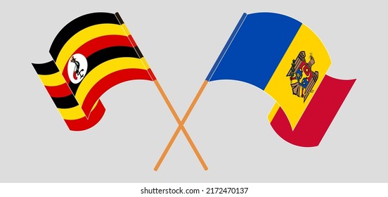 Crossed and waving flags of Uganda and Moldova. Vector illustration

