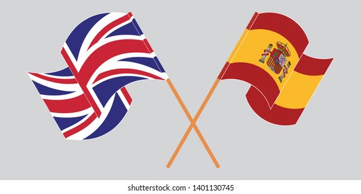 Crossed and waving flags of the UK and Spain