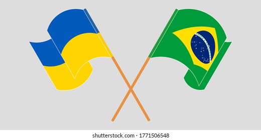 Crossed and waving flags of the Ukraine and Brazil