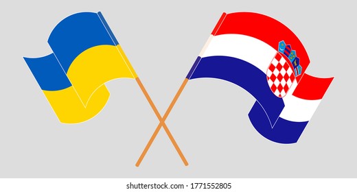 Crossed and waving flags of the Ukraine and Croatia