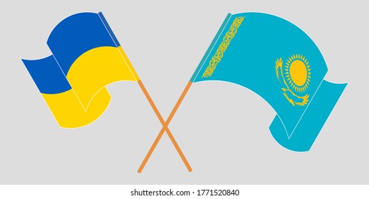 Crossed and waving flags of the Ukraine and Kazakhstan