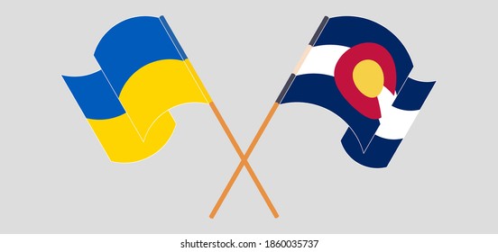 Crossed and waving flags of The Ukraine and The State of Colorado